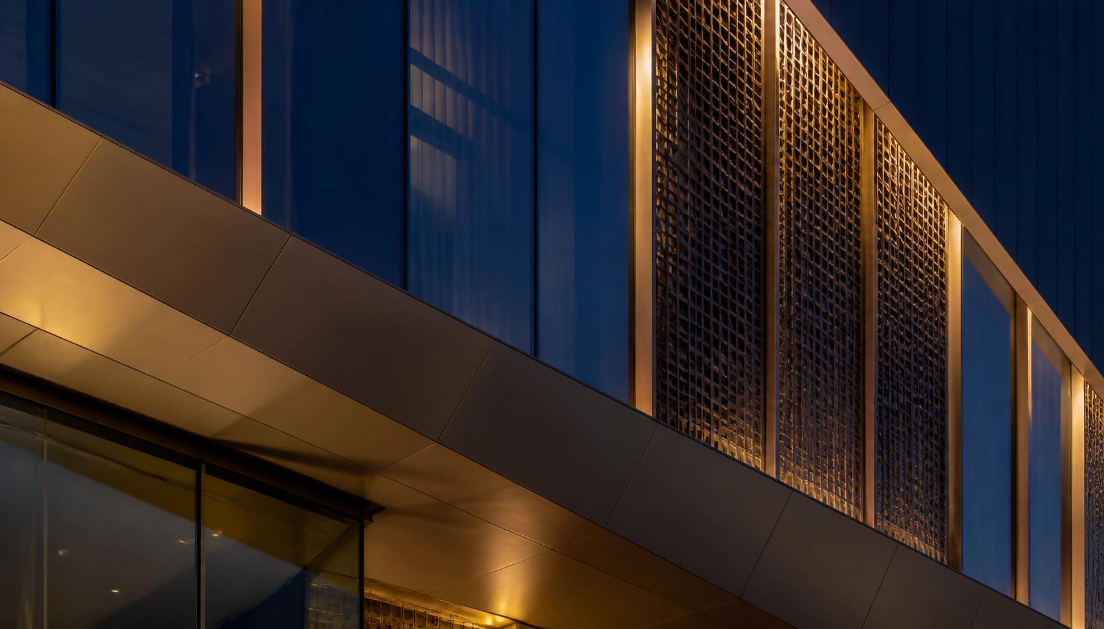 Architectural detail of a contemporary Doha facade at dusk